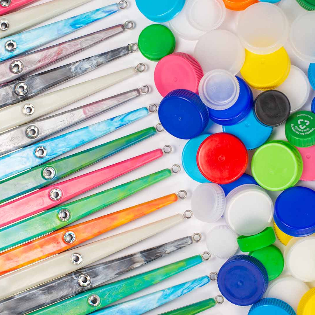 Colorful plastic bottle caps and lids on a white background